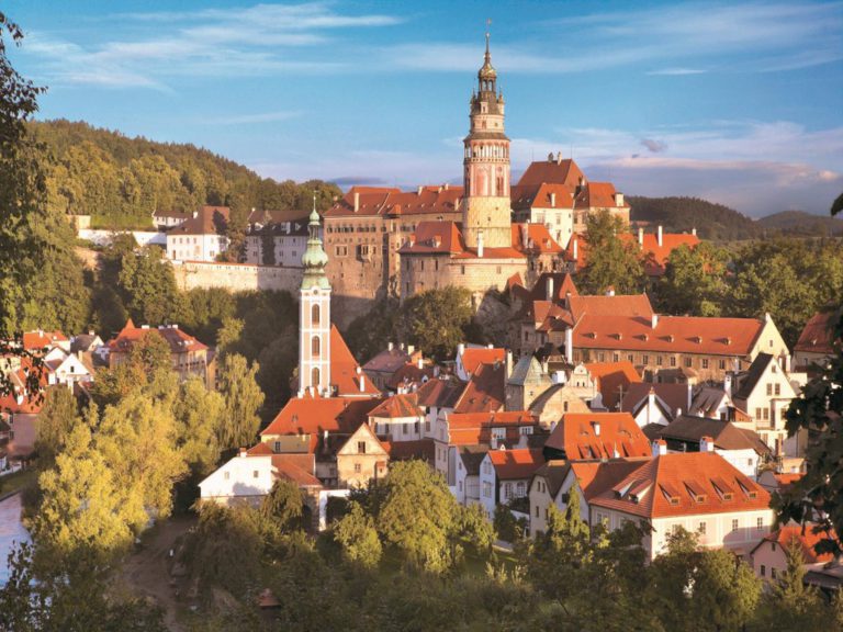 Český Krumlov castle tower above the red roofs of the old town