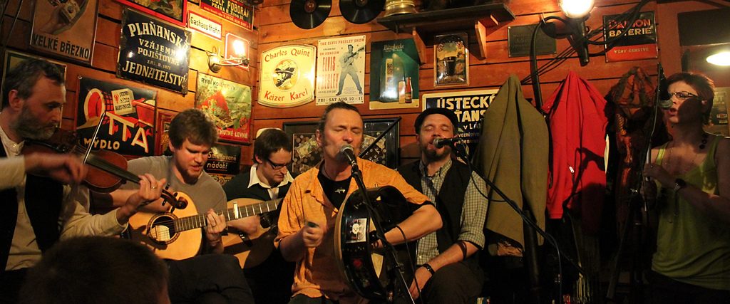 Musicians playing a traditional session in an Irish pub in the Czech Republic