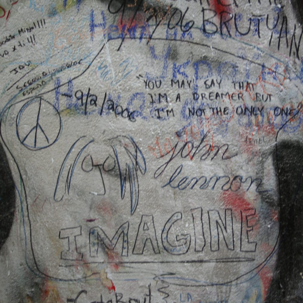A sketch of John Lennon and the word Imagine written on the Lennon Wall