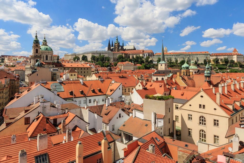 Red roofs of Malá Strana with St Nicholas Church and Prague Castle