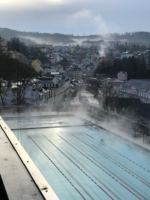 Swimming lanes of the Thermal outdoor pool with a view over Karlovy Vary